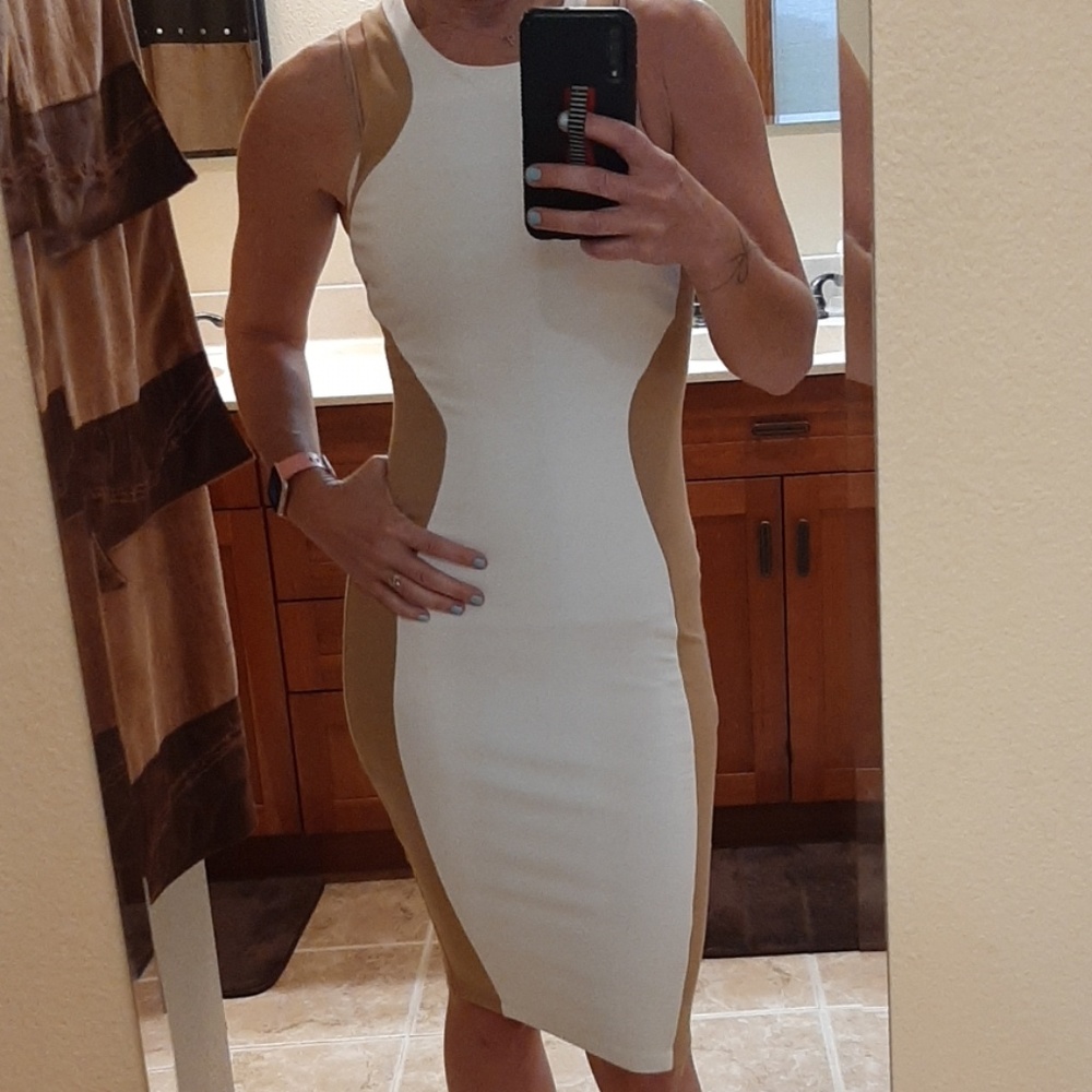 Fitting dress. Torn by Ronny Kobo